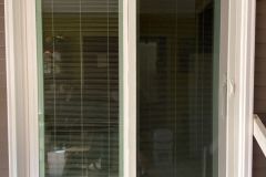 Blinds between glass