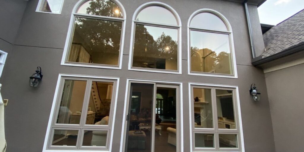 Homeowner preparing a room by clearing furniture and window coverings before a professional window installation | How to Prepare Your Home for a Window Installation